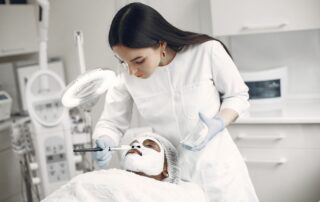 esthetician at a medspa giving a patient treatment